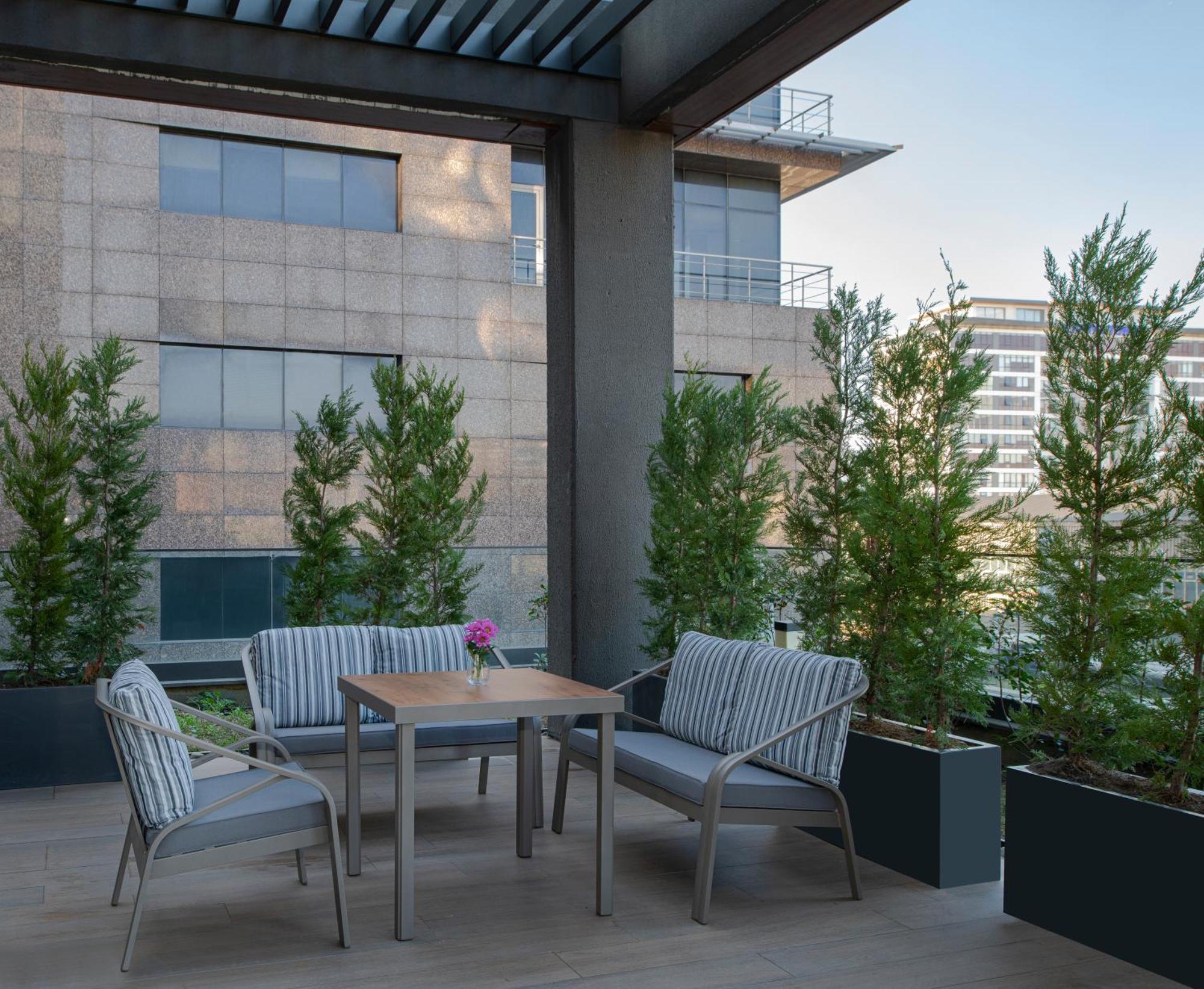 Movenpick Living Istanbul West Hotel Exterior photo A 3D rendering of a patio