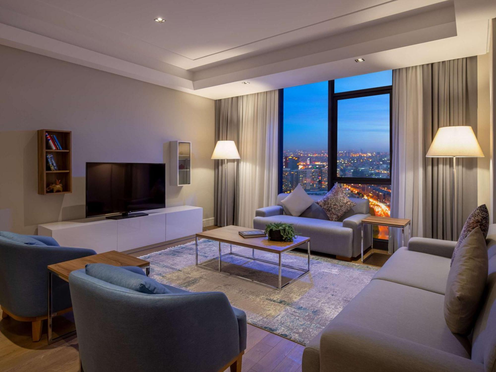 Movenpick Living Istanbul West Hotel Exterior photo A living room in a suite at the hotel